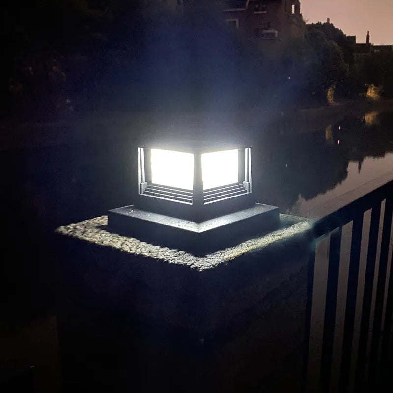 Outdoor solar pillar lamp, IP44, 160mm x 160mm x 110mm, abstract design, available in Black or White for courtyard and garden use.