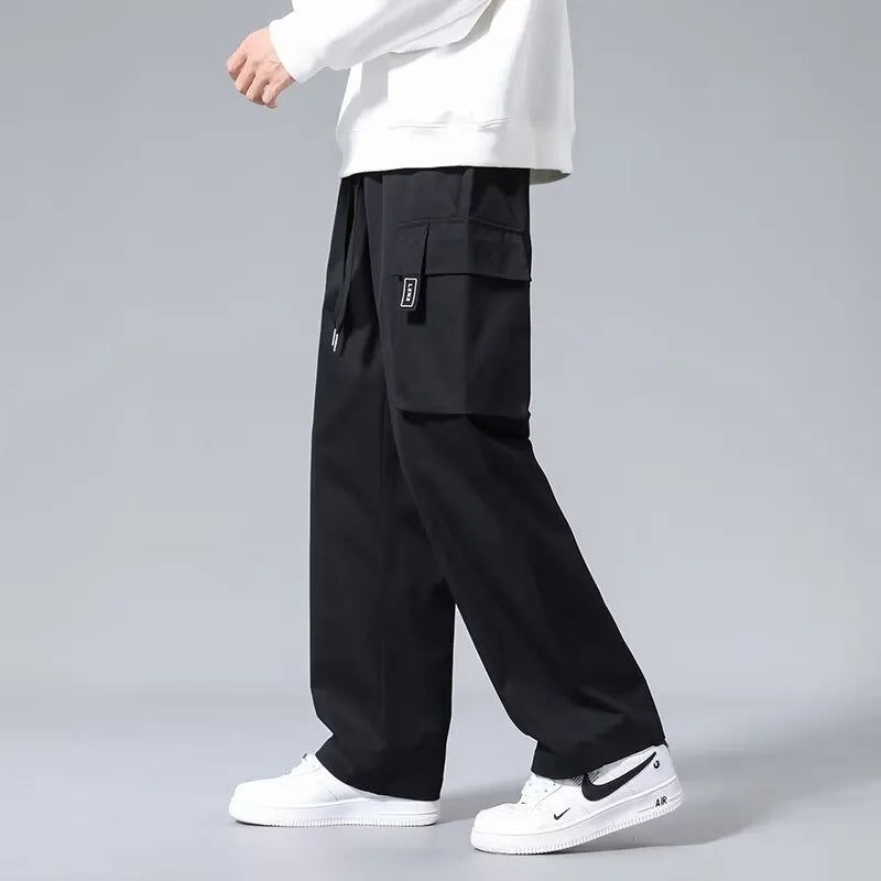 Boys straight leg cargo pants in army green with large pockets and a drawstring waist.