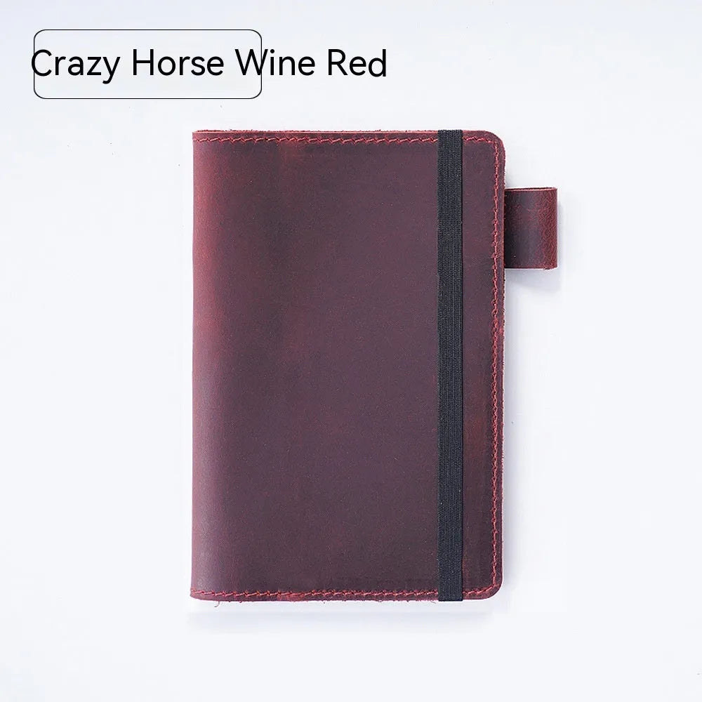 Handmade kraft notebook with cowhide cover in choice of six colours, showing open pages of wood-free paper.