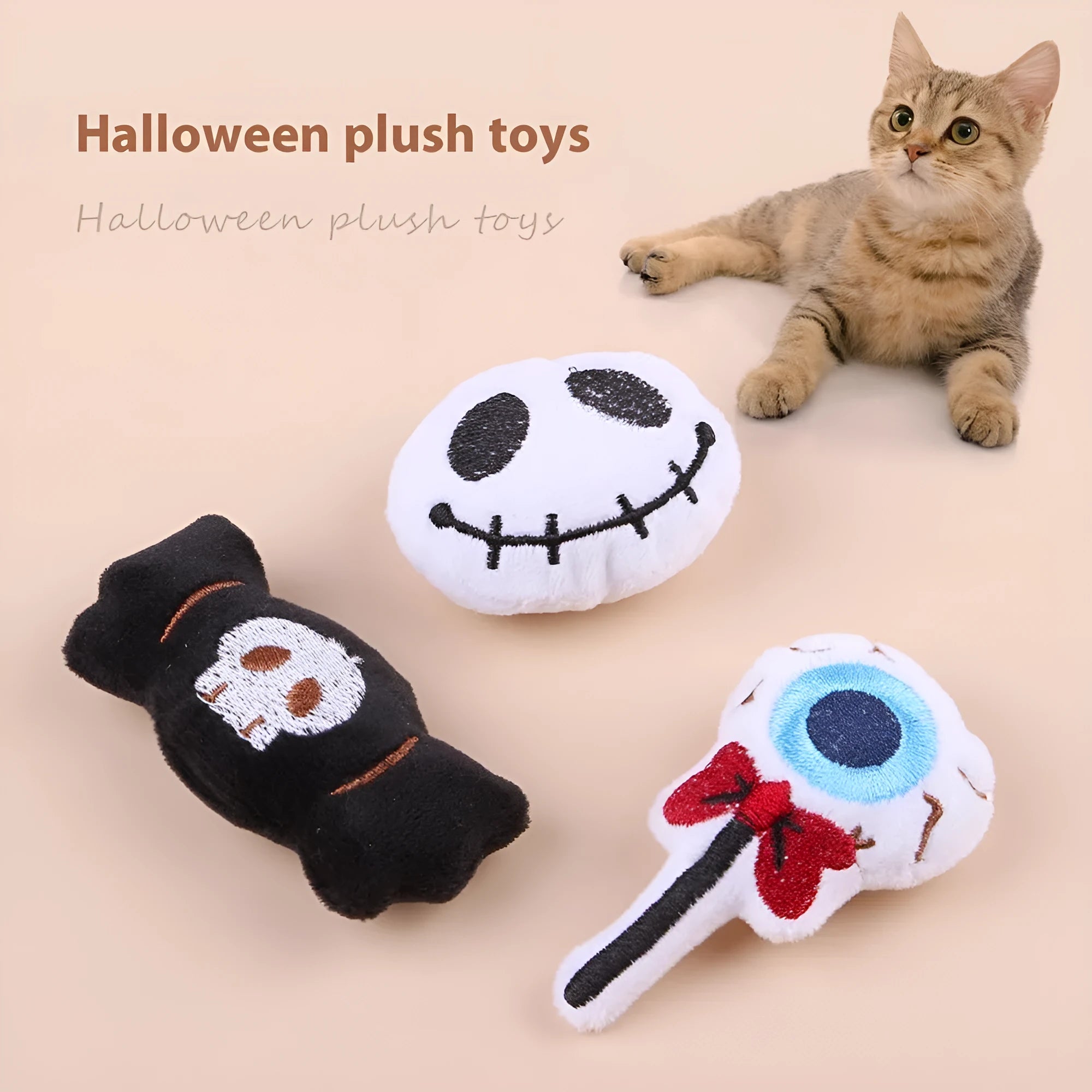 Plush cat teaser toy with candy, eyes and skull attachments on handheld wand