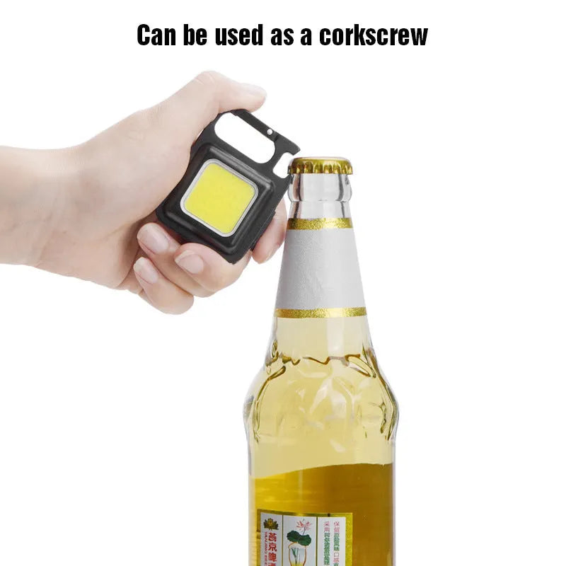 Black aluminium alloy USB rechargeable keychain flashlight with magnetic base and foldable handle