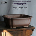 Purple sand rectangular ceramic bonsai pot on a flat surface.