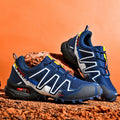 Men's casual shoe in synthetic leather with mesh lining and rubber sole, shown in grey orange colour.