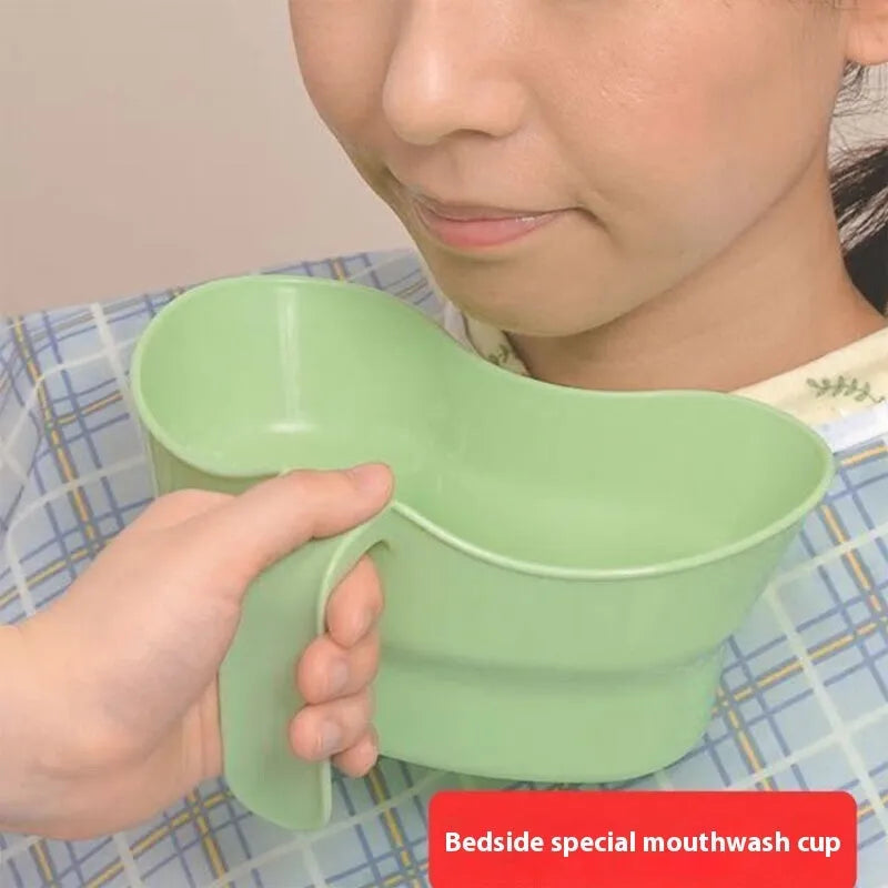 Green plastic nursing gargle cup with spout for bedridden patient drinking assistance