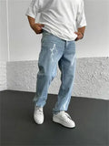 Men's blue straight-leg denim jeans with mid waist and zipper fly on solid background