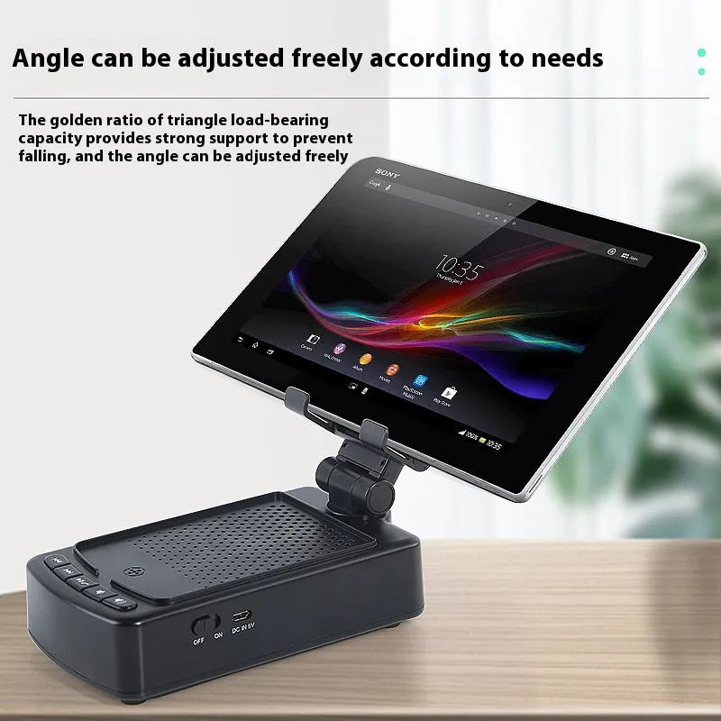 Multifunctional plastic tablet and phone holder with audio in black on a desk