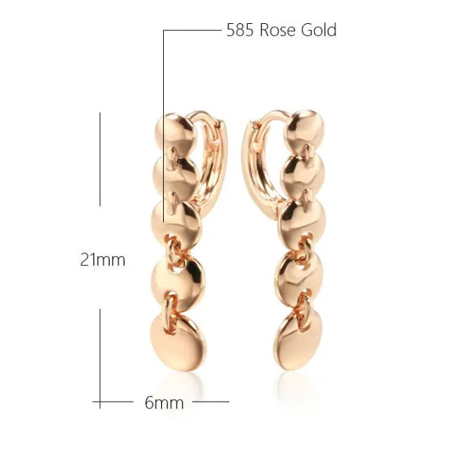 A pair of gold-coloured retro long round circle earrings with a woven copper texture.