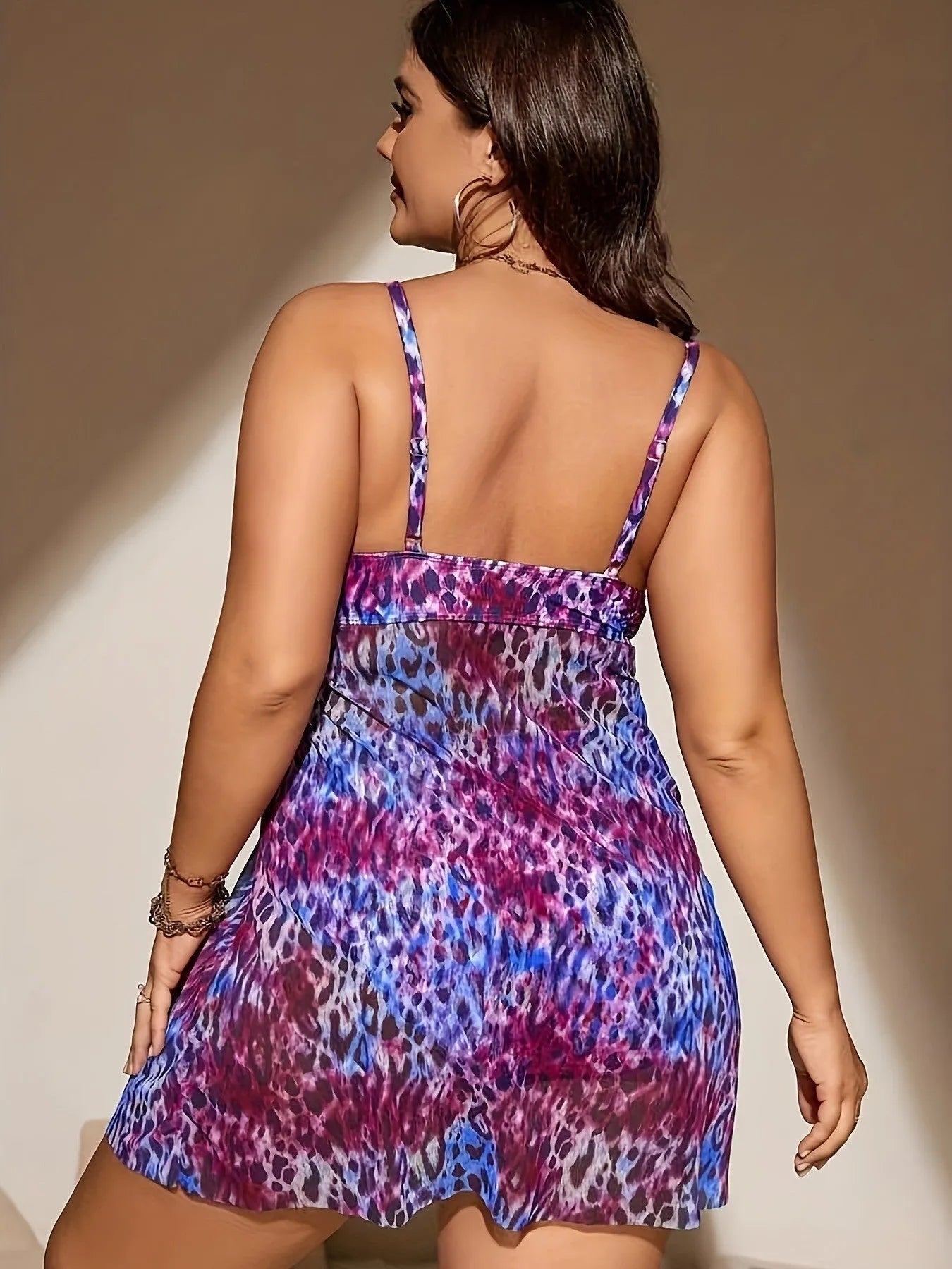Plus size women's split bikini set in polyester swim fabric with sleeveless top and shorts