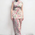 Women's long sleeve printed chiffon dress set with high-waist skirt on a mannequin