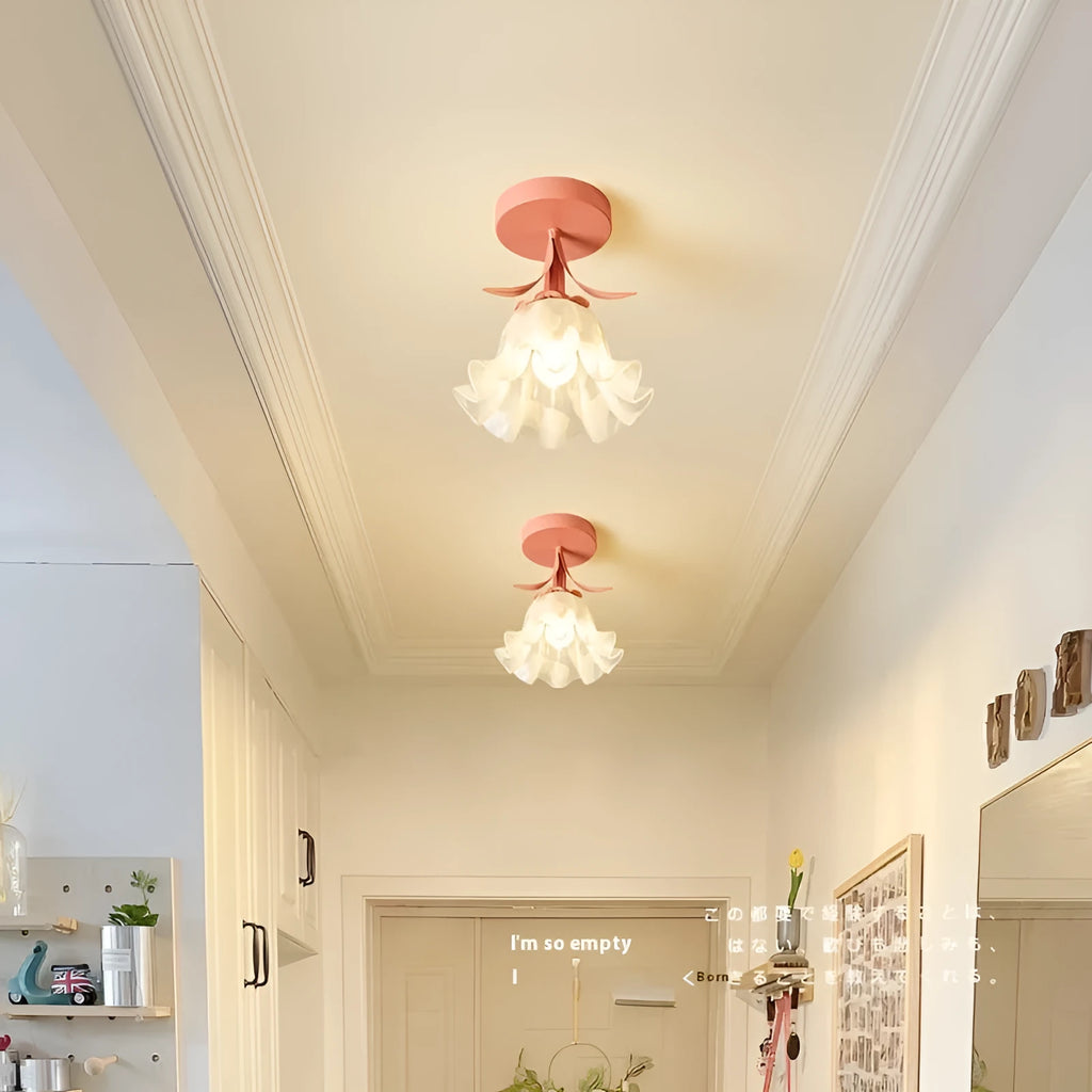 Cream coloured modern LED corridor wall light with remote control for three-colour changing and dimming.
