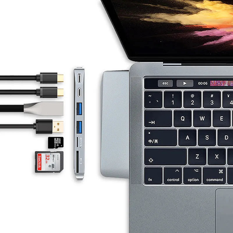 USB-C expansion adapter with eight ports for MacBook Pro showing dual connectors and multiple interface options