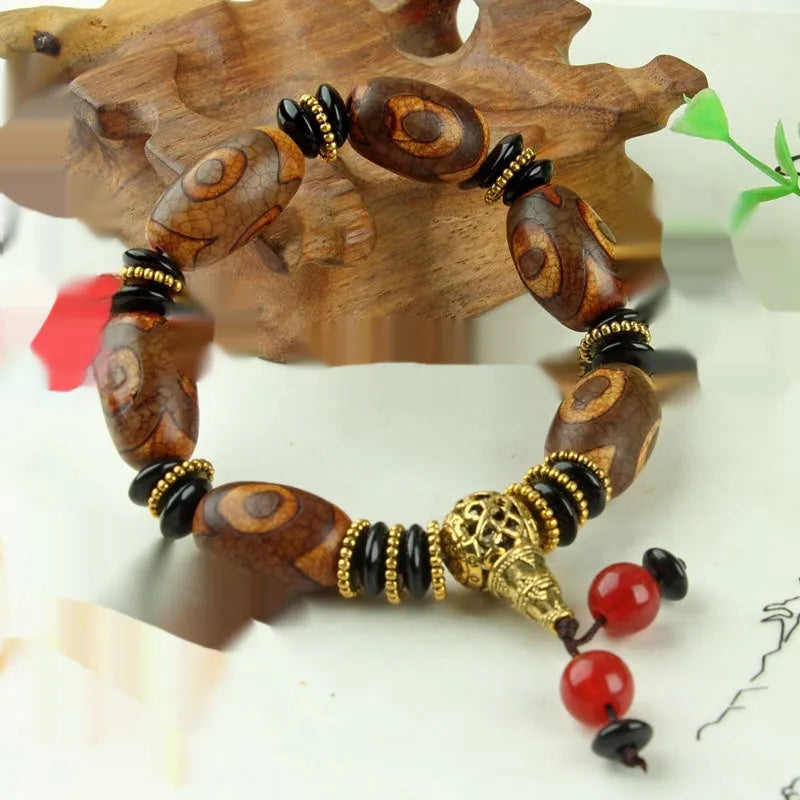 Distressed agate Tibet beads bracelet with three eye dzi design and polished stone beads