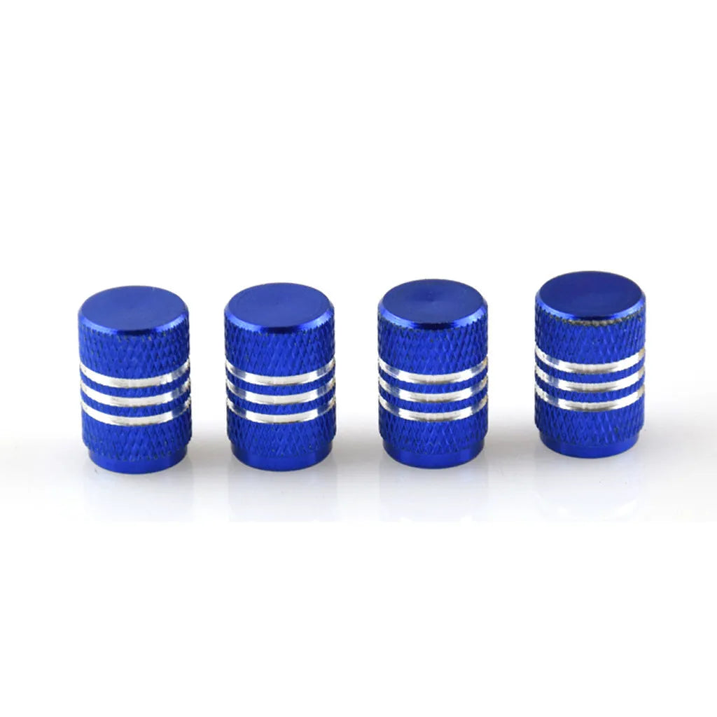 Set of aluminium alloy car tyre valve caps in multiple metallic colours showing stainless steel construction