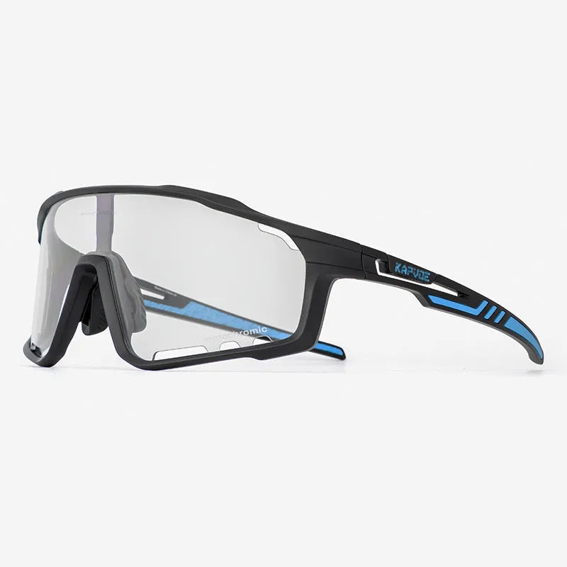 Close-up of photochromic cycling goggles with TR90 frame and semi-rimless design on a handlebar.