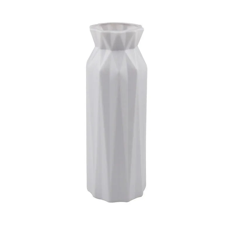 Green melamine drop-resistant vase with a wide base on a wooden table