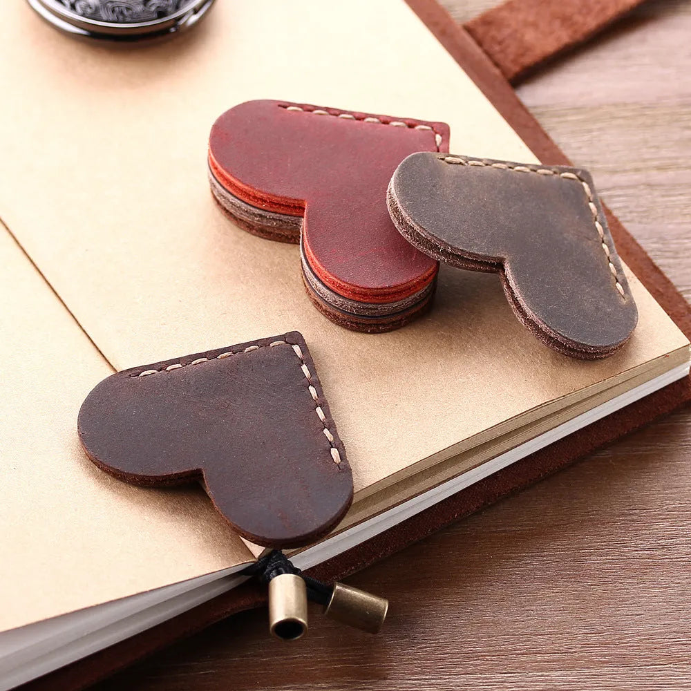 Heart-shaped bookmark in brown crazy horse leather with textured surface and handmade edges