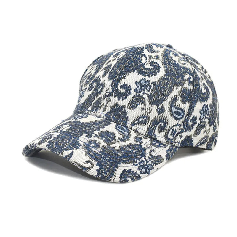 Blue polyester baseball cap with printed paisley pattern showing dome crown design