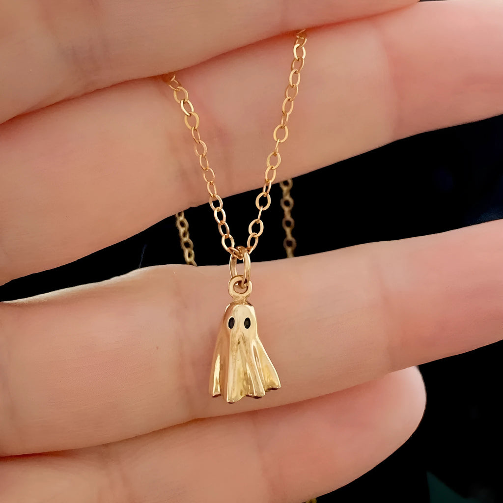 Stainless steel necklace with a detailed titanium steel ghost pendant on a twisted chain.