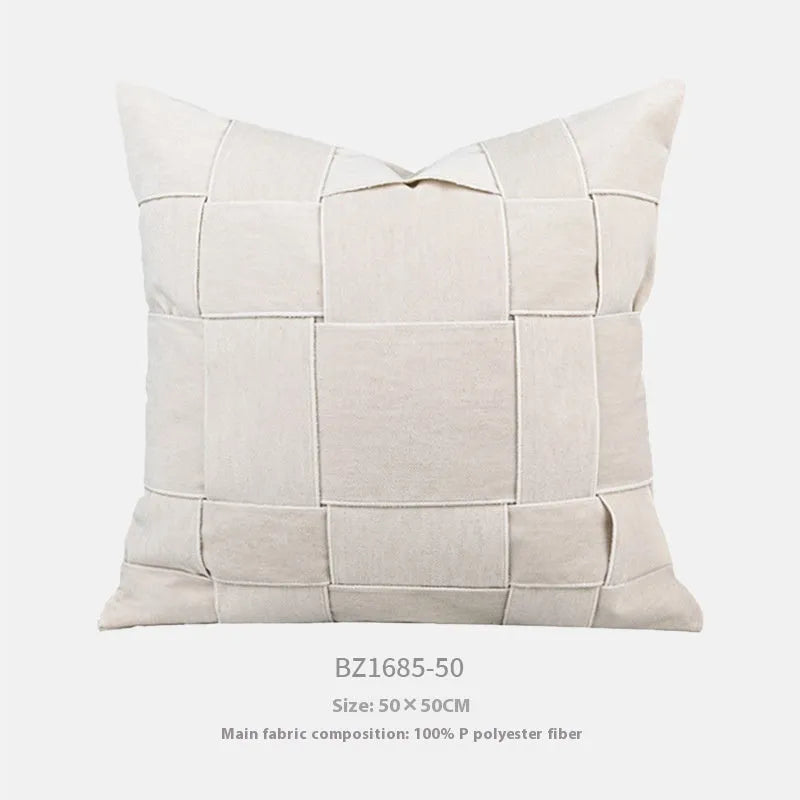 Square chenille woven cushion in a choice of colours, shown on a sofa, measuring 50x50cm.