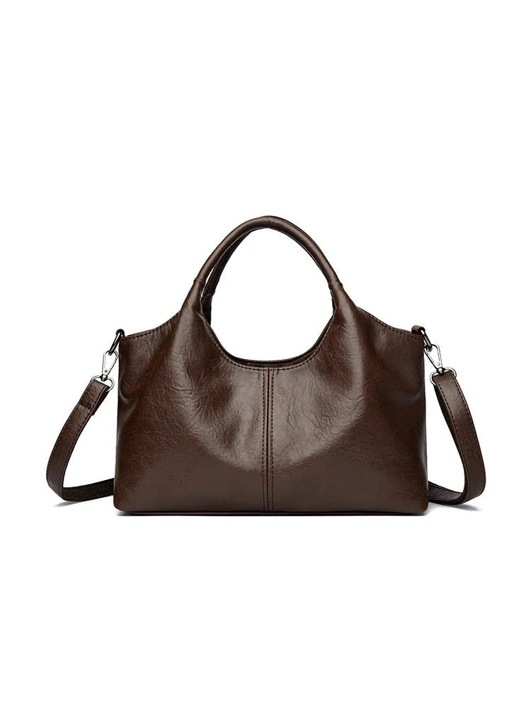 Genuine leather women's cross-body bag in beige colour showing large capacity design