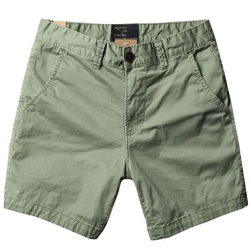 Men's straight-leg cotton casual shorts in a loose fit, shown in a solid colour with a zipper fly.