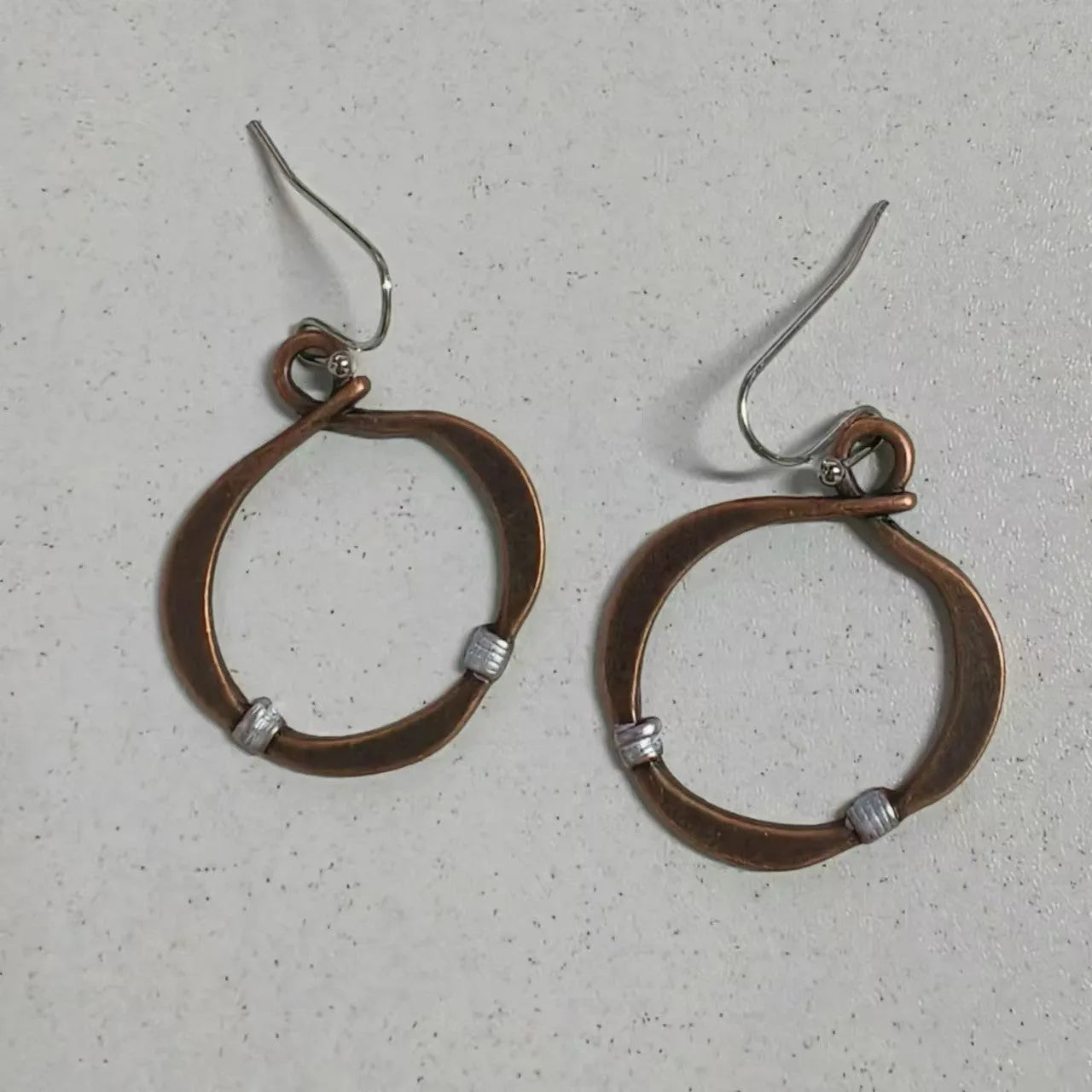 Bronze retro hollow round geometric bohemian earrings for women on light background