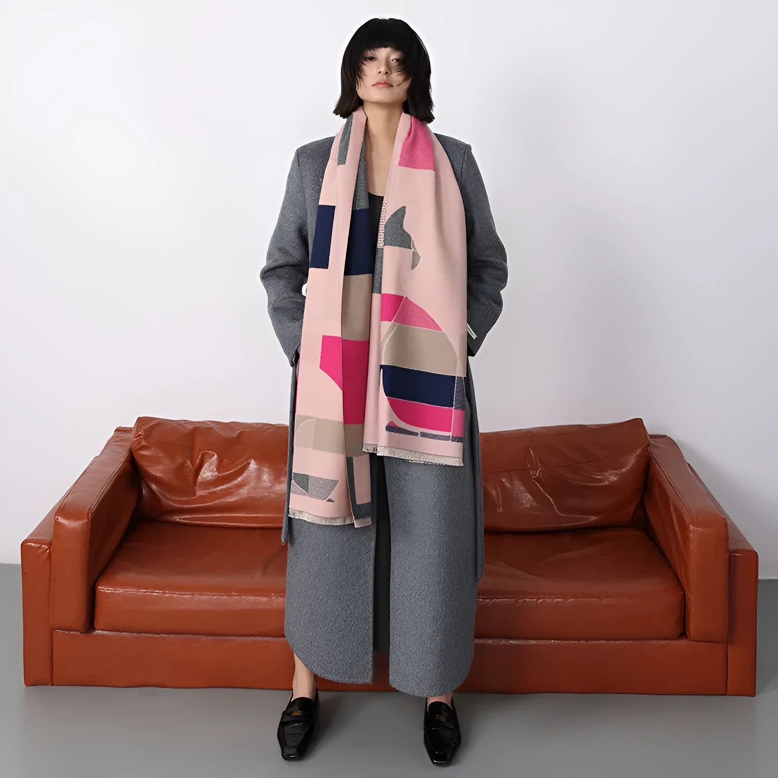 Long beige imitation cashmere style polyester scarf draped to show its 185 cm length and texture.
