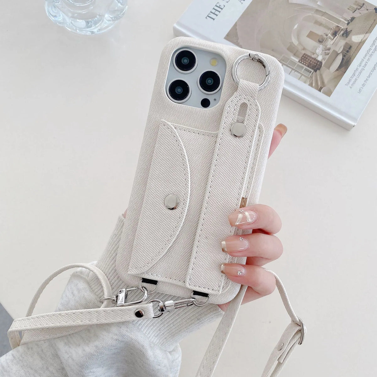 Denim blue leather phone case for iPhone 15 with wrist strap and built-in stand