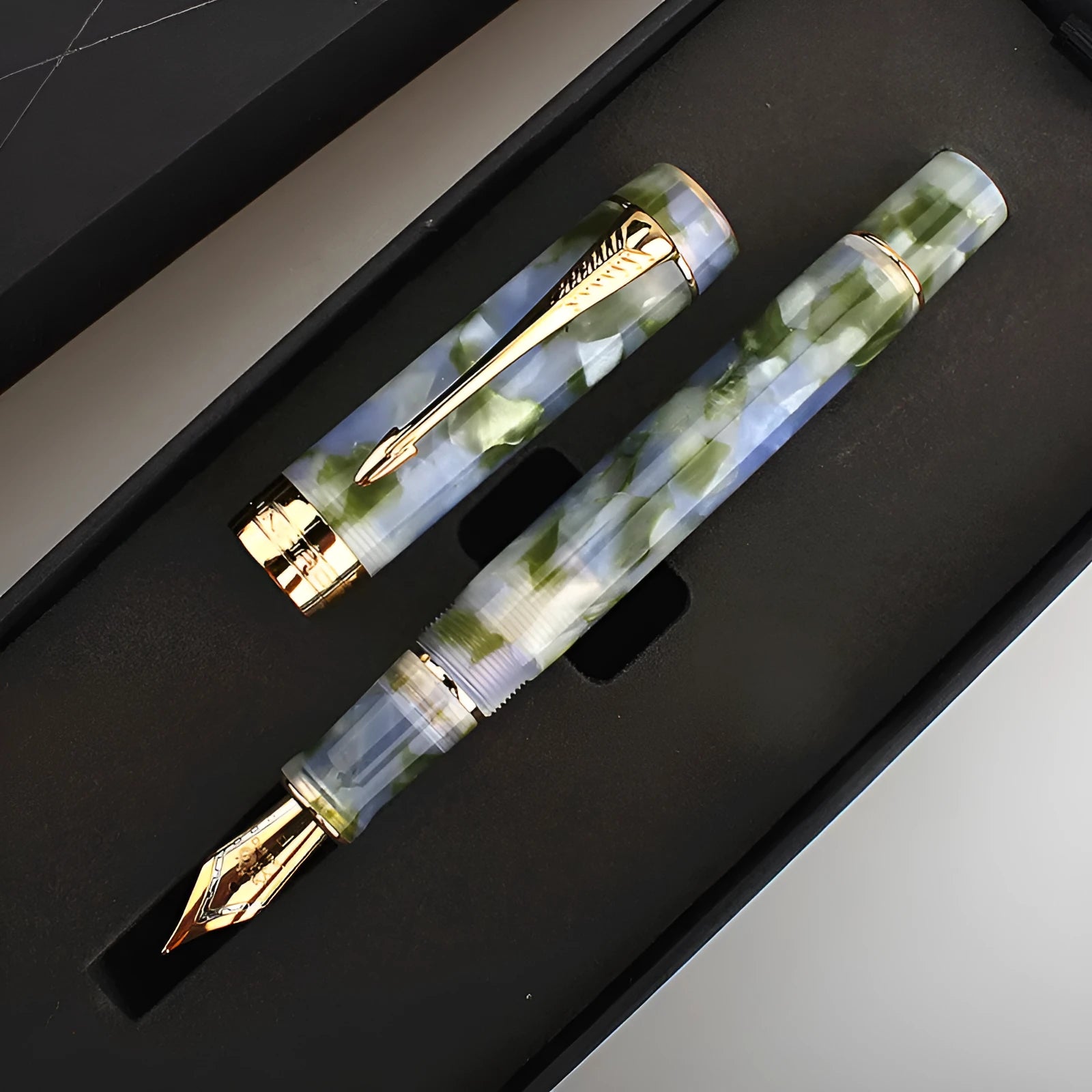 Deep bath green metal ballpoint pen showing three different tip size options