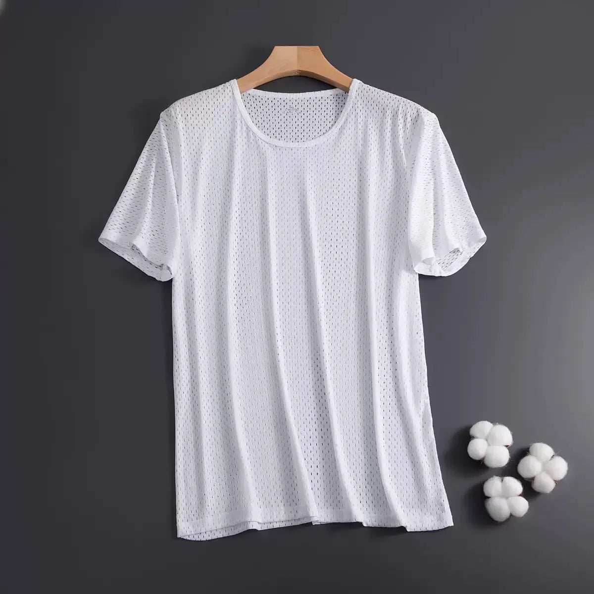 Man wearing a solid colour ice silk short sleeve crew neck T-shirt in a loose fit.