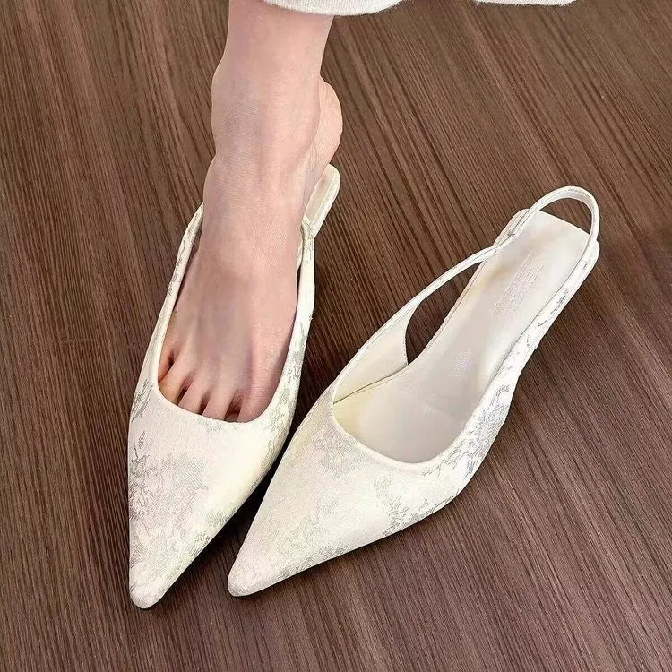 White faux suede mid heel stiletto court shoes with Mary Jane strap, pointed toe, and rubber sole, sizes 35-39