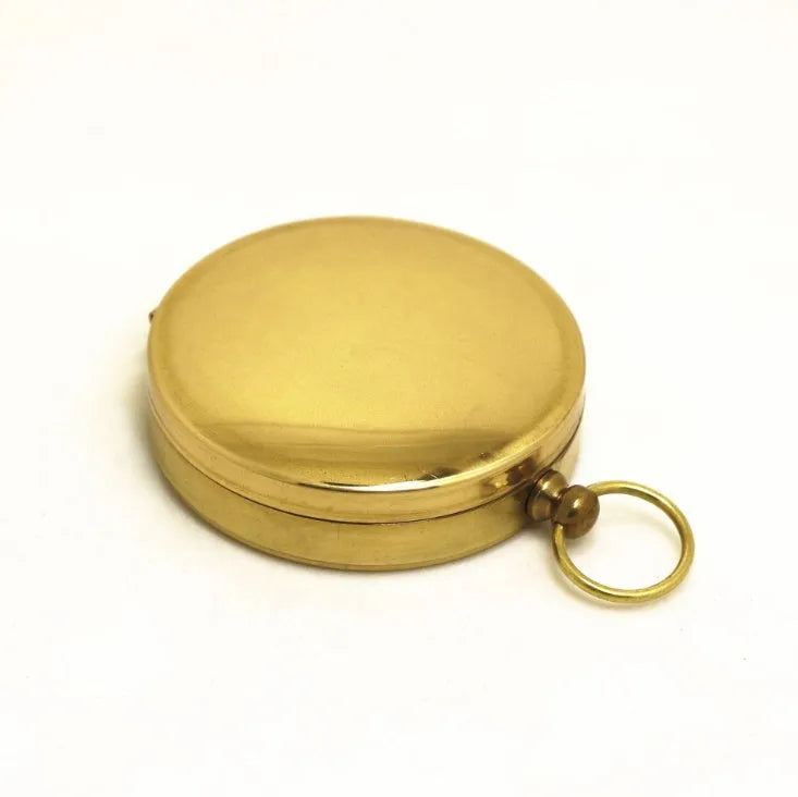 Metal flip compass outdoor pocket watch compass gold colour copper-tone close-up