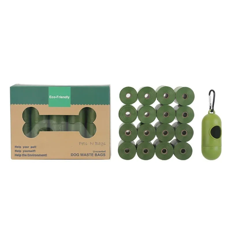Green EPI degradable pet waste bags on a roll next to a white dispenser.
