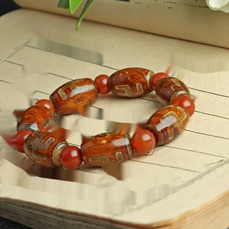 Distressed agate Tibet beads bracelet with three eye dzi design and polished stone beads