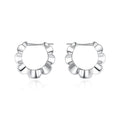 Pair of sterling silver geometric earrings with round design elements and electroplated finish