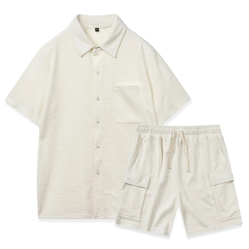 Beige polyester two-piece set with short sleeve top and elastic waist shorts laid flat.
