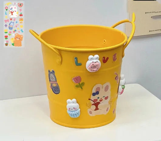Round metal desktop pen holder in a choice of colours including green, pink, red, white, and yellow.