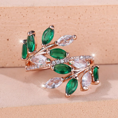 Adjustable horse eye design leaf ring in copper with zircon crystals, shown in a rose gold finish