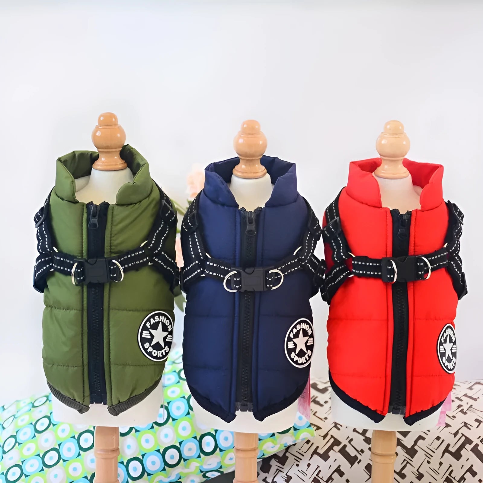 Waterproof dog coat with integrated harness in red, navy blue, and army green colours for winter.