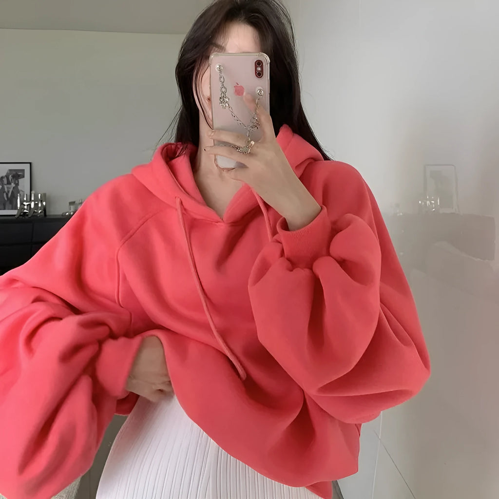 Women's loose watermelon red hooded sweater made from mulberry silk, shown sleeveless.