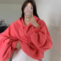 Women's loose watermelon red hooded sweater made from mulberry silk, shown sleeveless.