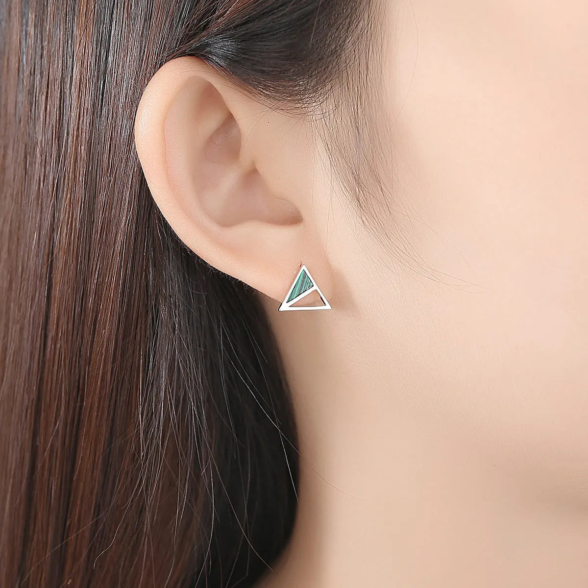 Green malachite stud earrings in silver with a geometric design and pure silver inlay gem setting