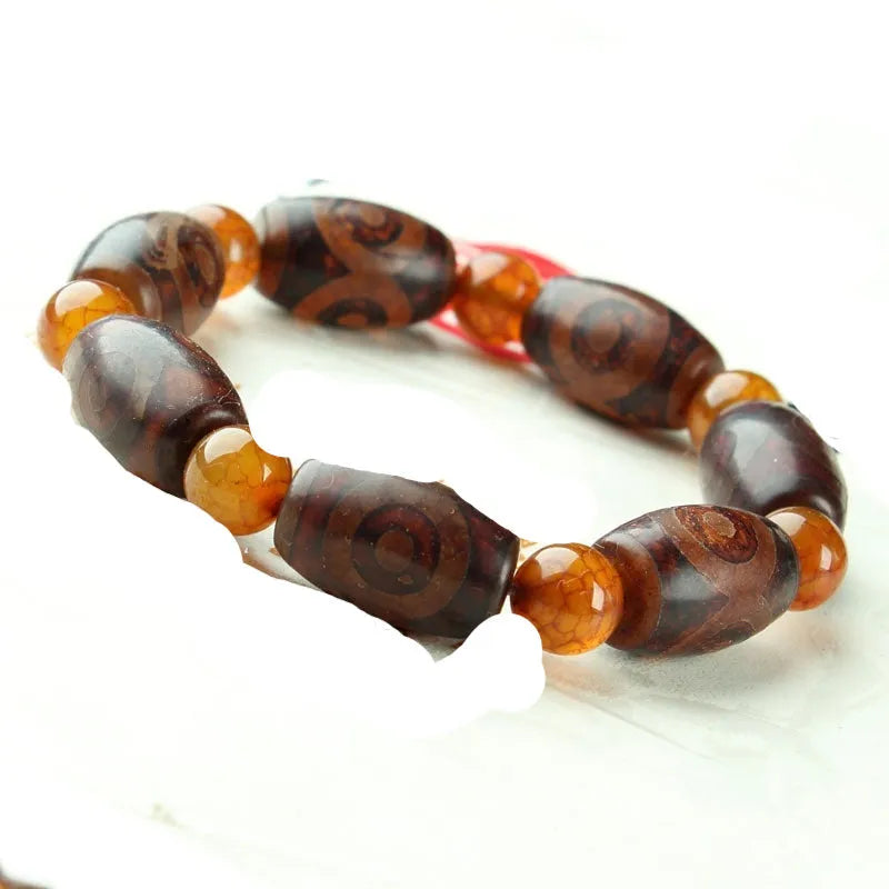 Distressed agate Tibet beads bracelet with three eye dzi design and polished stone beads