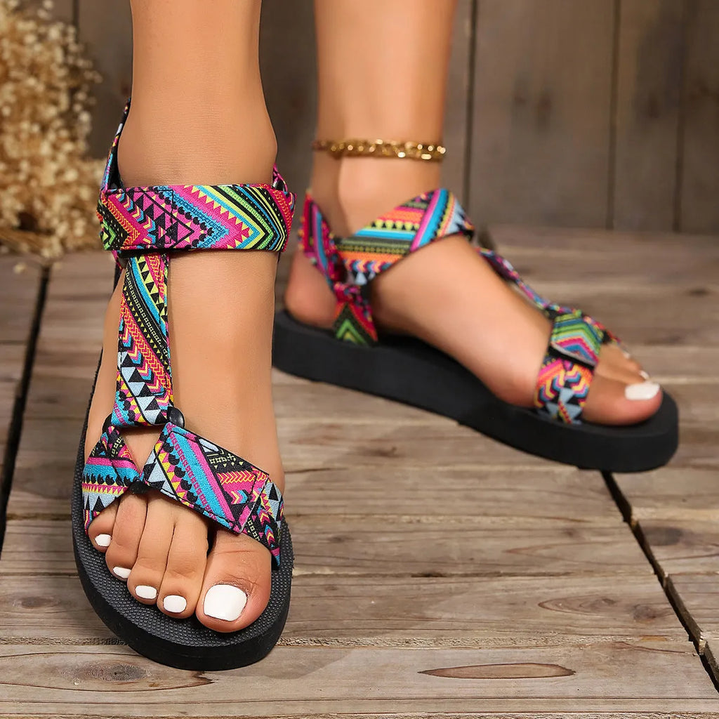 Women's ethnic print flat sandals with Velcro webbing strap and foam sole in blue and red colourways