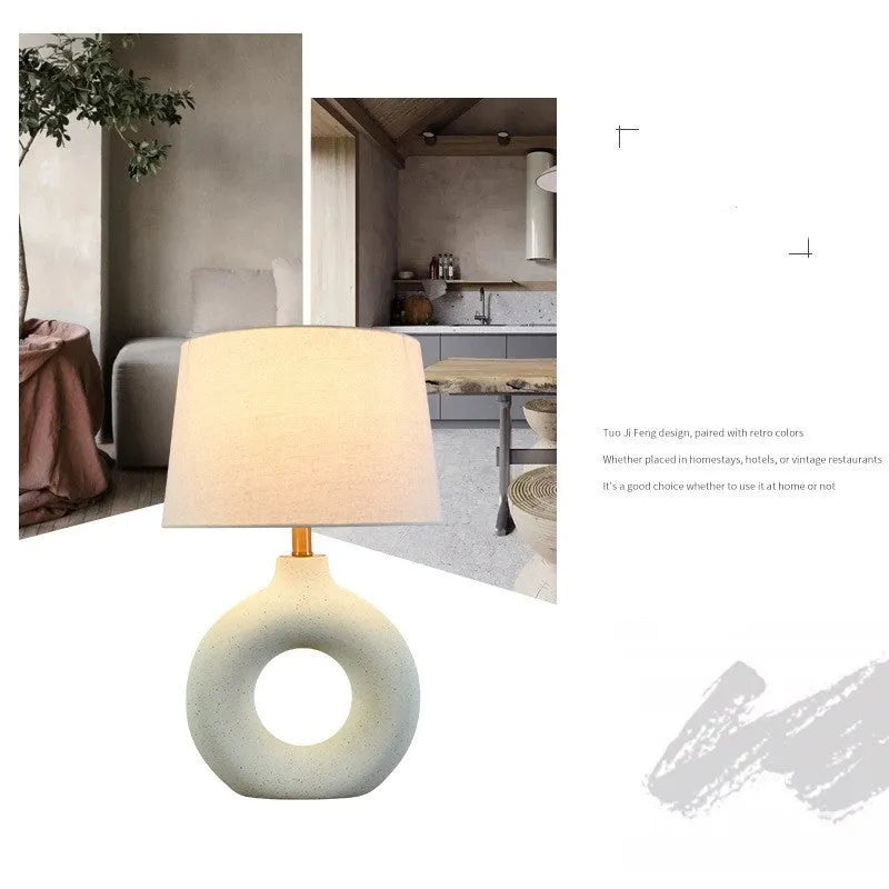 Feng pottery pot table lamp in Japanese style on a wooden desk.