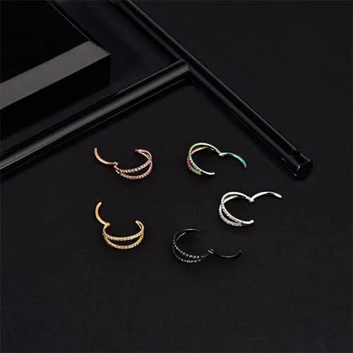 G23 titanium alloy nose ring with zircon accent in steel colour on a grey background.