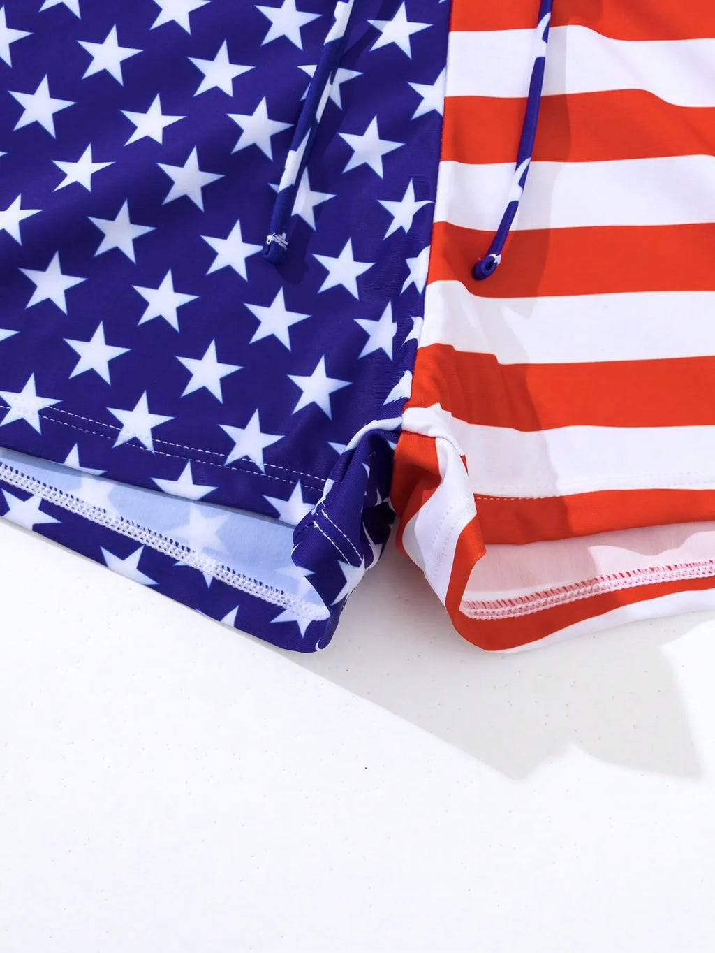 Women's high waist boxer style swimsuit with drawstring in red, white, and blue Stars and Stripes pattern