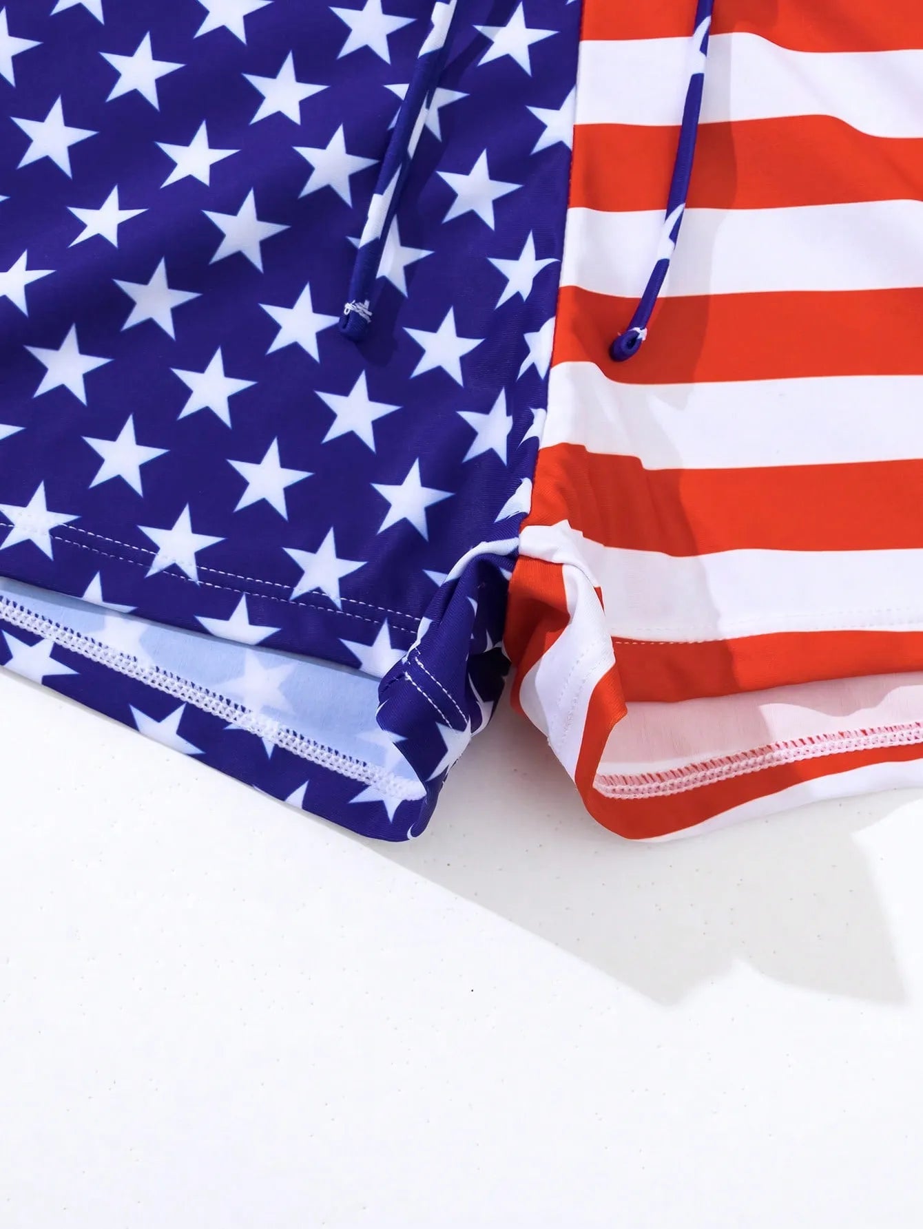 Women's high waist boxer style swimsuit with drawstring in red, white, and blue Stars and Stripes pattern