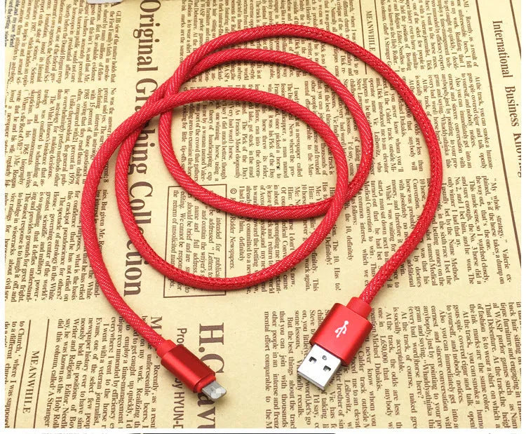 Cowboy-style denim USB-C charging cable with aluminium connectors in black, blue, or red.