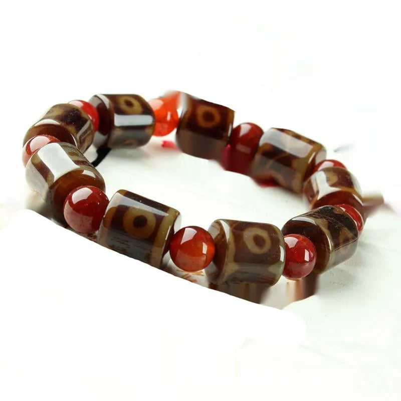 Distressed agate Tibet beads bracelet with three eye dzi design and polished stone beads